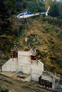 Casting fresh concrete for mountain works at Mérens les Vals (Ariège)