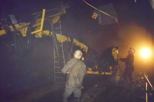 Ascending drilling using an articulated arm and a turret at 360° in a steep descending passageway