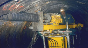 Drilling prior to draining in a small-size tunnel feeding a hydroelectric power plant. 