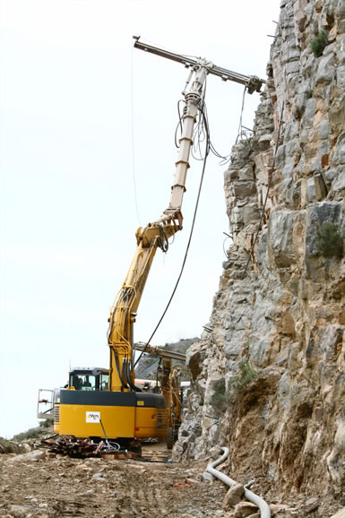 Excavator-mounted drilling rigs to work in difficult-to-access areas