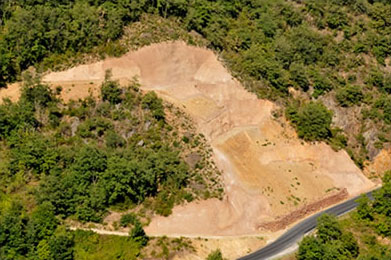 Colored nailed wall to contain landslide on hillside