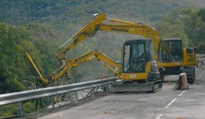 Our excavators are fitted with protective pads for roadway pavement preservation.